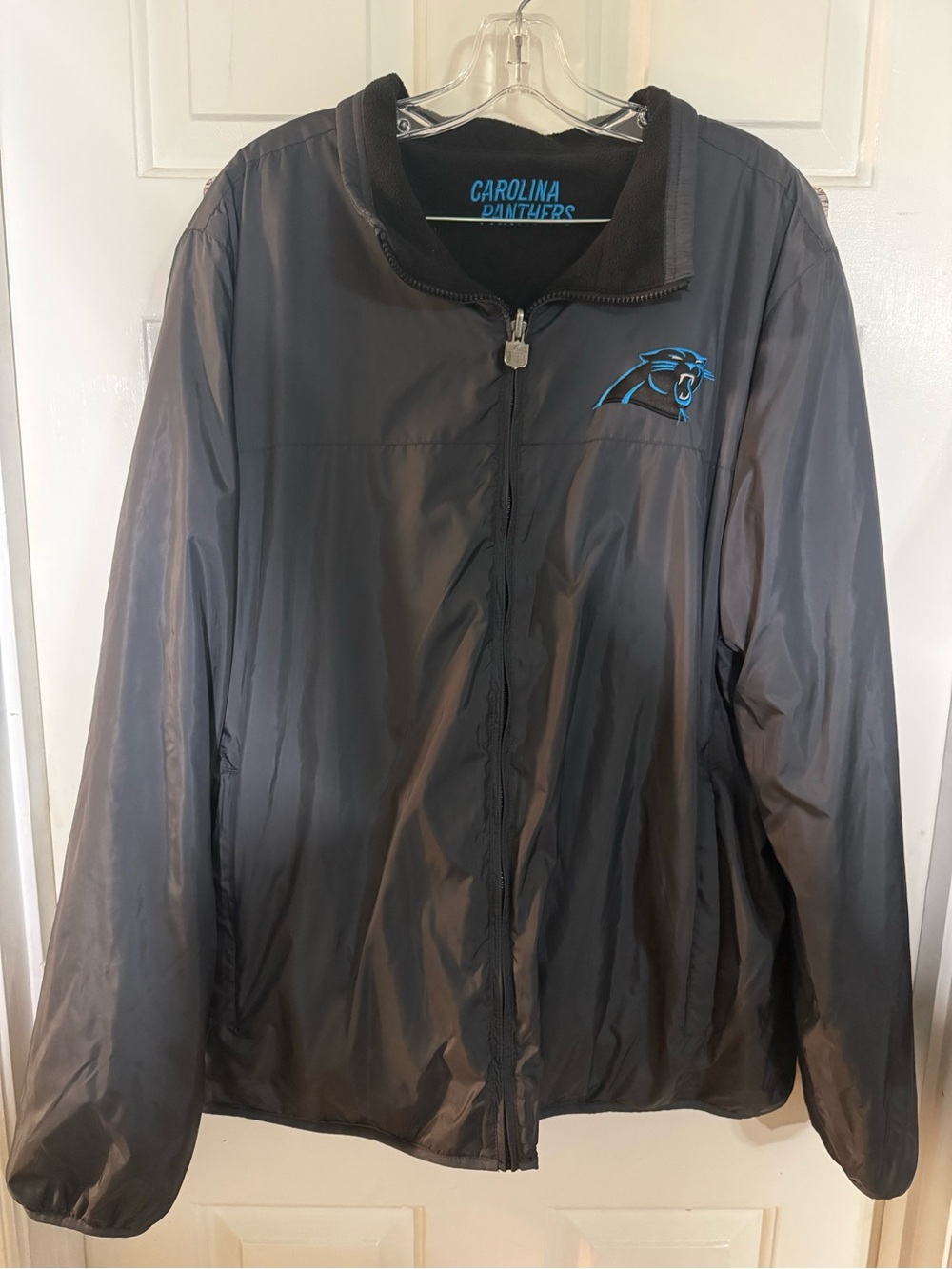 Carolina Panthers NFL Reversible Black Jacket with Silver Shield Zipper Pull
